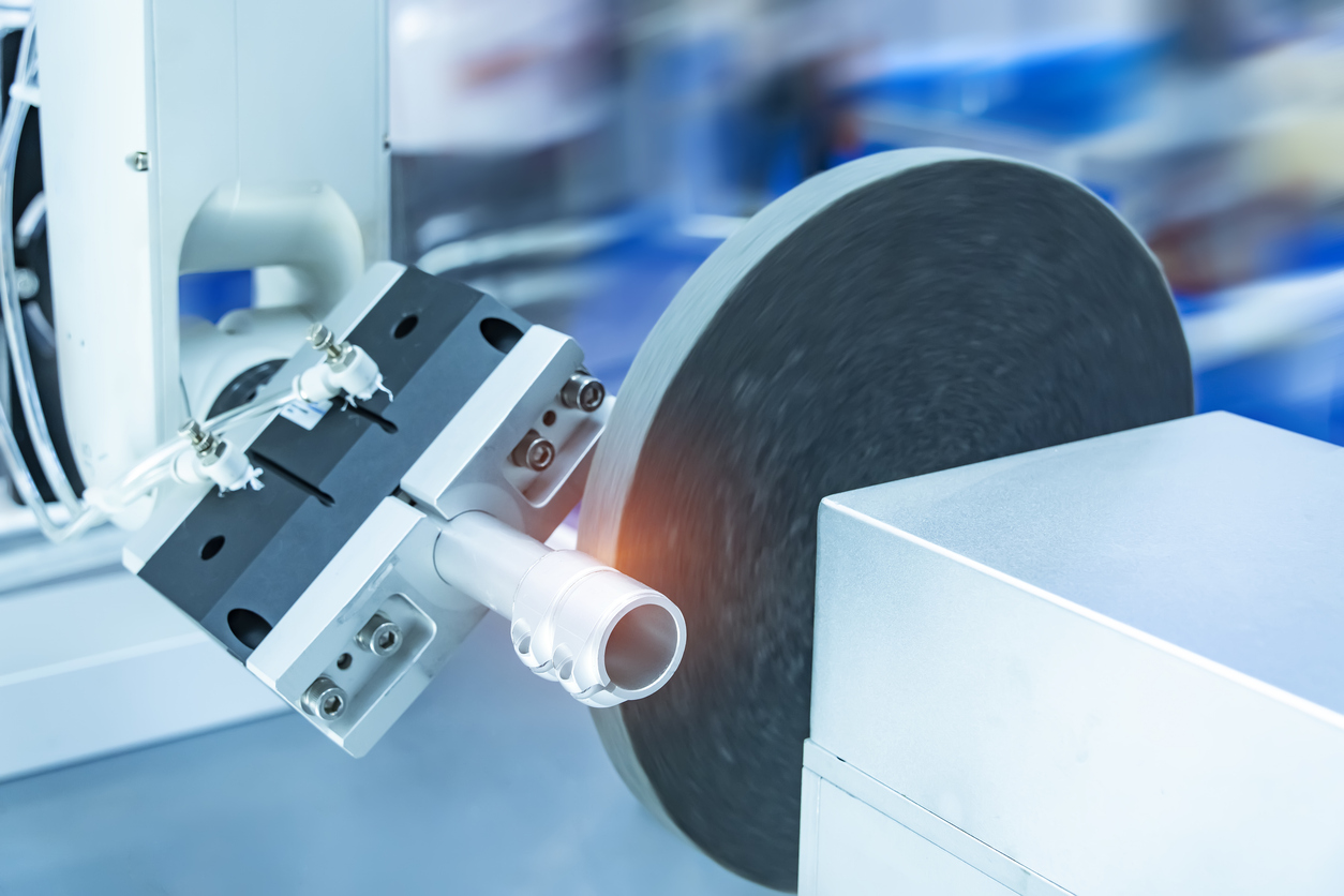 automatic arm handling the metal machined shaft parts polishing between the production line