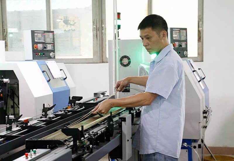 The workers who are placing the production materials for the pogo pins 2