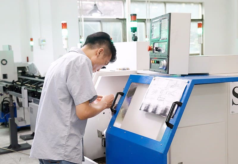 The workers who are placing the production materials for the pogo pins 3