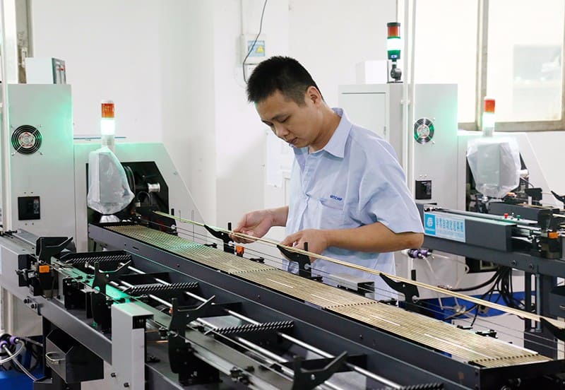The workers who are placing the production materials for the pogo pins