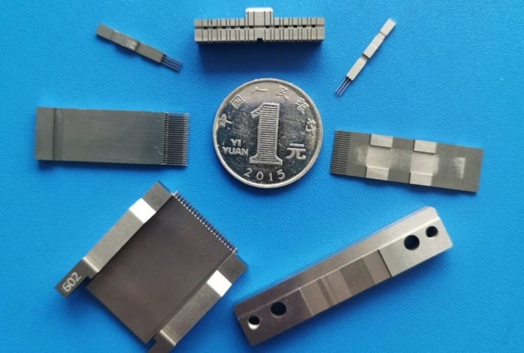 Miniature precision CNC parts the size of a coin
